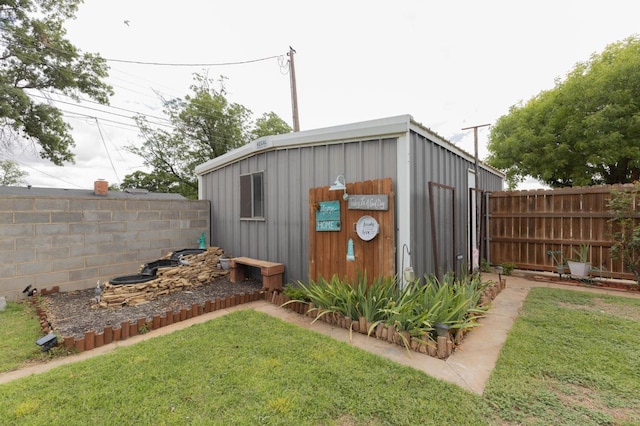 view of outbuilding featuring a yard