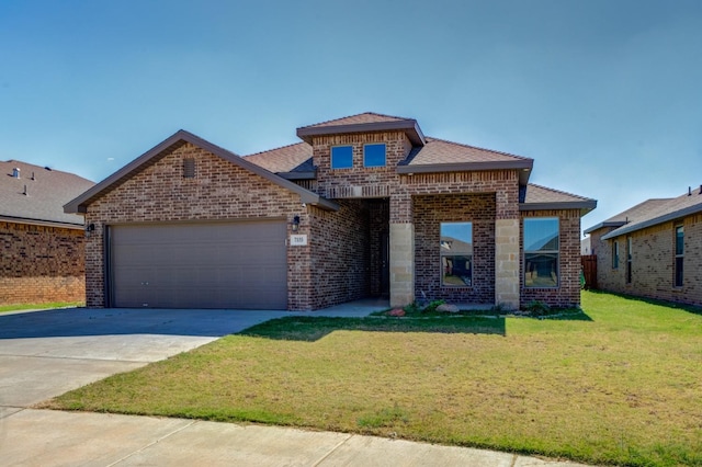 view of front facade with a garage and a front yard