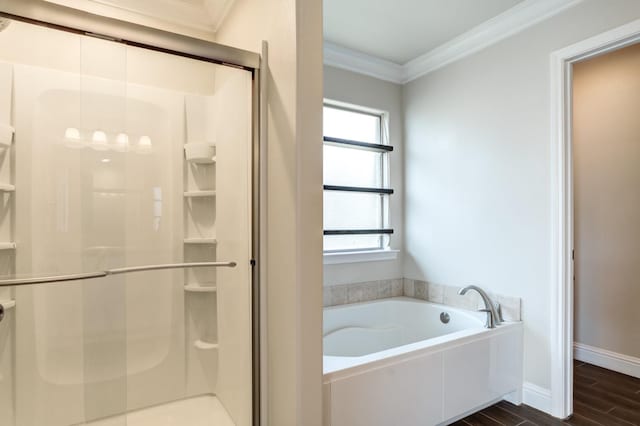 bathroom featuring shower with separate bathtub and ornamental molding