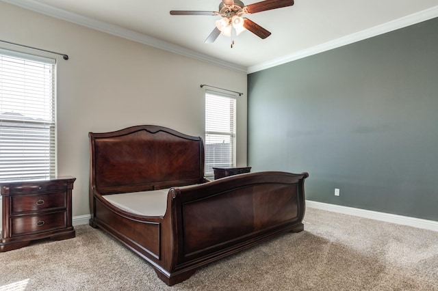 bedroom featuring crown molding, ceiling fan, and light carpet