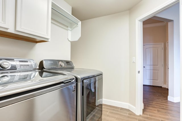 laundry area with cabinets and washer and dryer