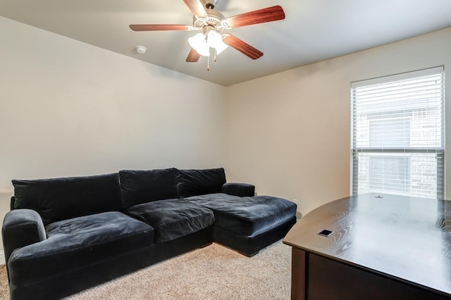 carpeted living room featuring ceiling fan