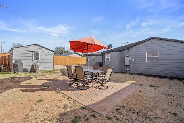 view of patio featuring a shed