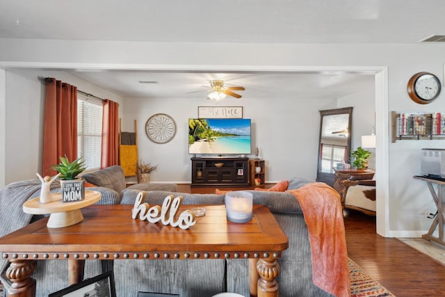 living room with wood-type flooring, a healthy amount of sunlight, and ceiling fan