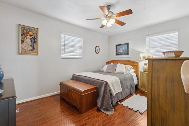 bedroom with ceiling fan and hardwood / wood-style floors