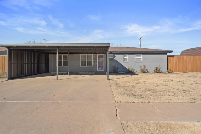 view of front of property featuring a carport