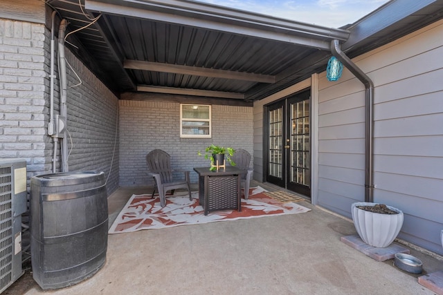 view of patio with french doors and central AC unit