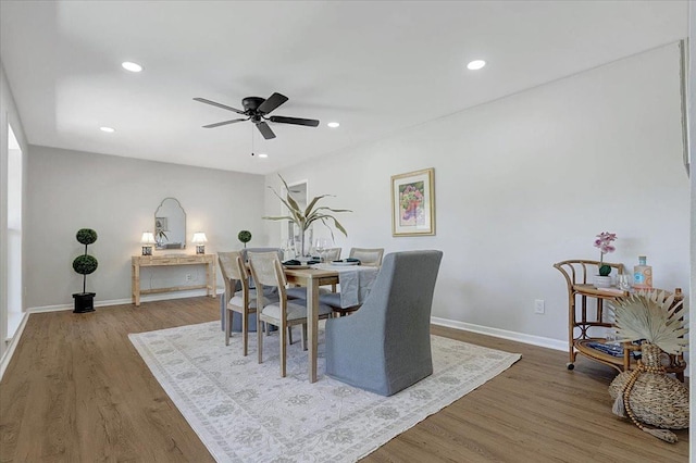 dining room featuring recessed lighting, a ceiling fan, baseboards, and wood finished floors