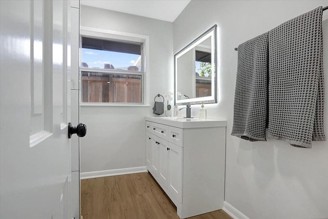 bathroom with vanity and hardwood / wood-style floors