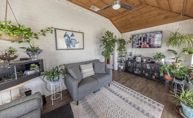 10323 Ave X, Lubbock, TX 79423 - living area featuring lofted ceiling, wood finished floors, wooden ceiling, ceiling fan, and brick wall