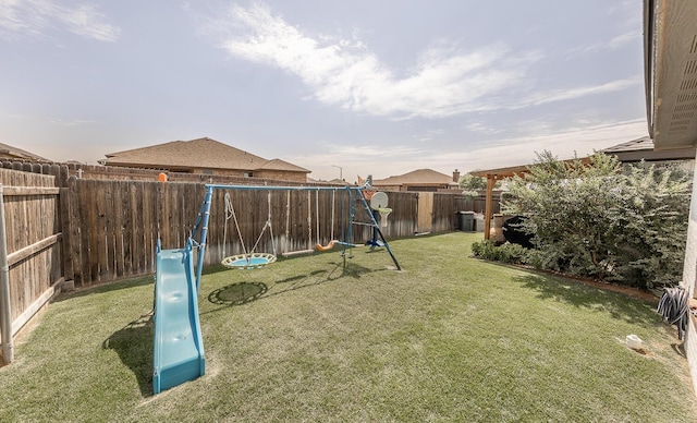 10323 Ave X, Lubbock, TX 79423 - fenced backyard featuring a playground