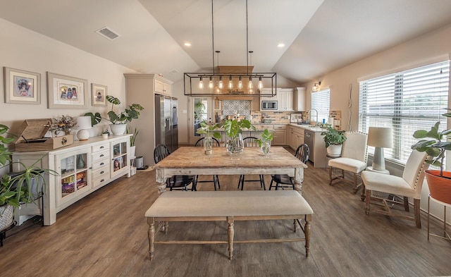 10323 Ave X, Lubbock, TX 79423 - dining area featuring lofted ceiling and dark wood finished floors
