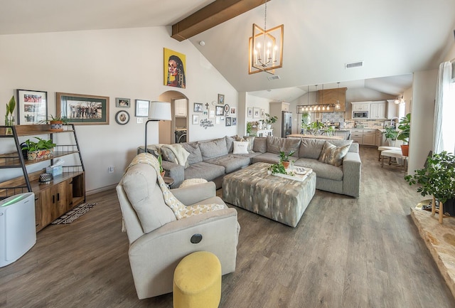 10323 Ave X, Lubbock, TX 79423 - living area featuring a chandelier, wood finished floors, arched walkways, high vaulted ceiling, and beamed ceiling