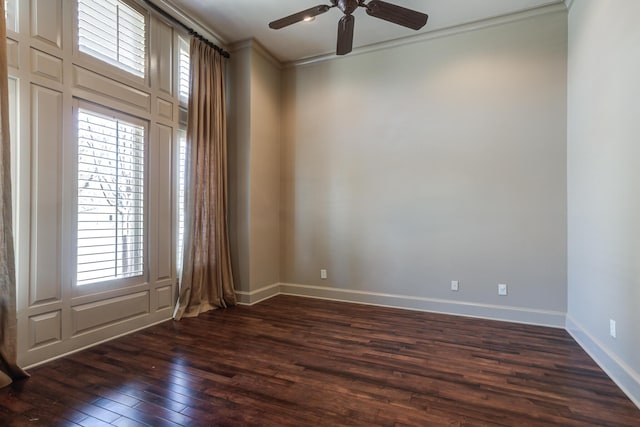 unfurnished room featuring a ceiling fan, baseboards, dark wood-style flooring, and crown molding