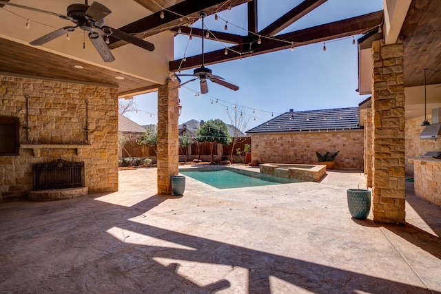 view of swimming pool with ceiling fan, a patio area, a fenced backyard, an outdoor stone fireplace, and a pool with connected hot tub