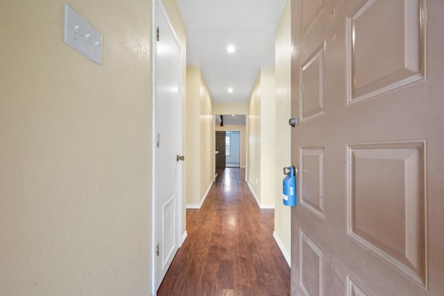 hallway featuring dark hardwood / wood-style floors