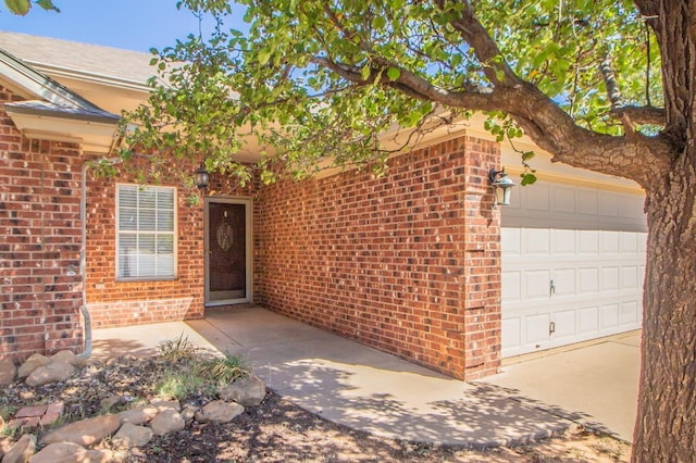 view of exterior entry featuring a garage