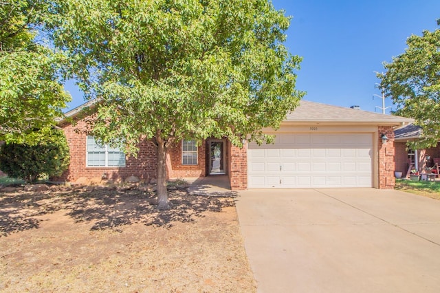 obstructed view of property with a garage