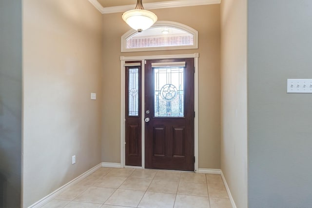 tiled foyer with ornamental molding