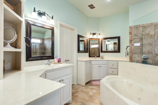 bathroom featuring vanity, a bath, and tile patterned floors