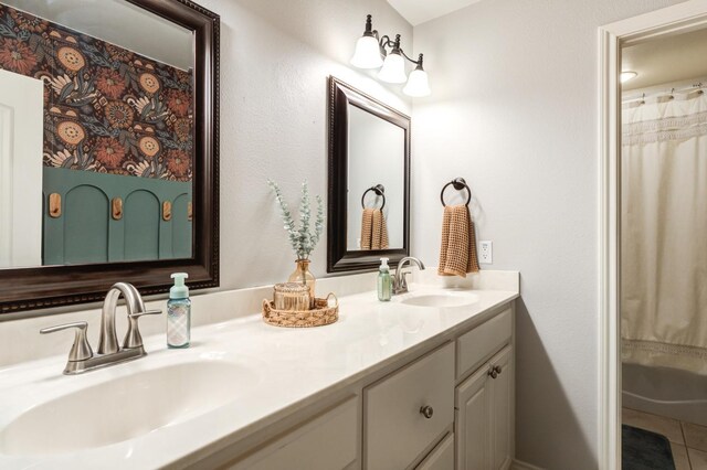 bathroom featuring vanity, tile patterned floors, and a shower with curtain