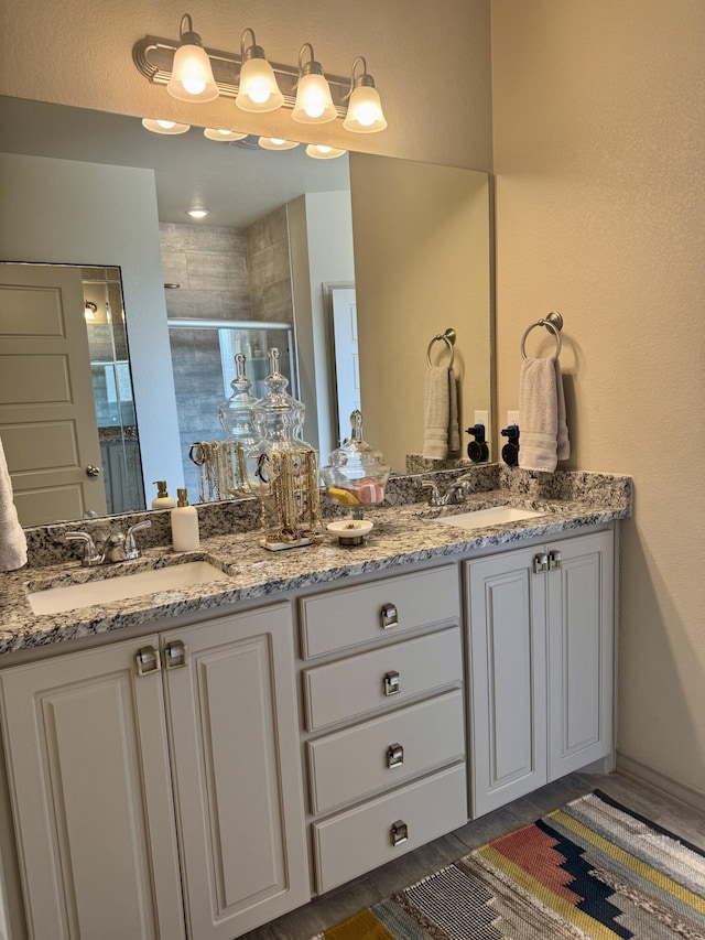 7101 22nd St, Lubbock, TX 79407 - bathroom with double vanity and a shower stall