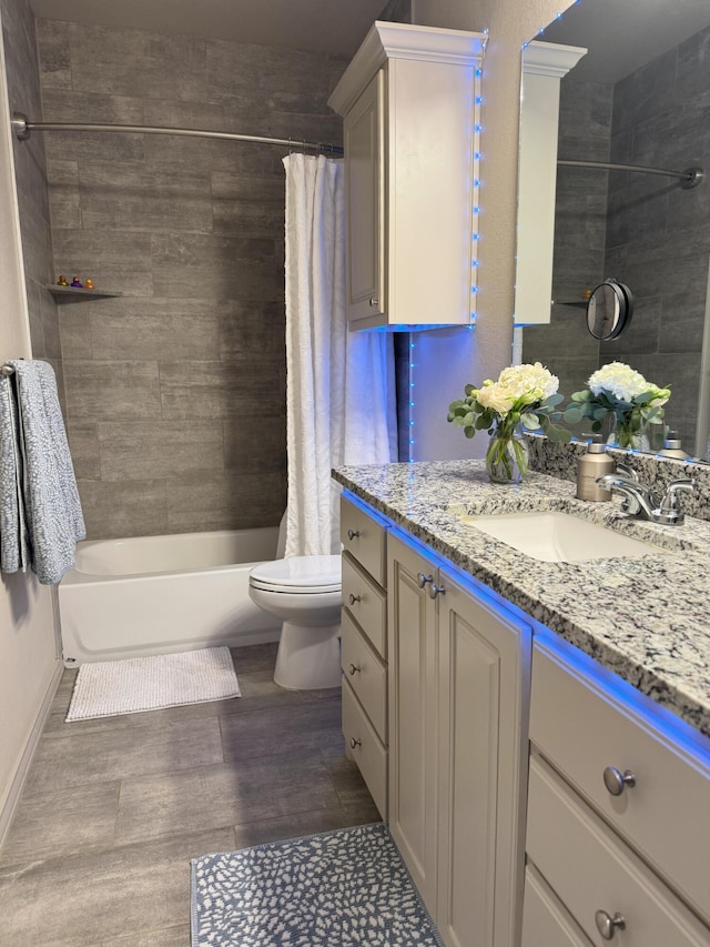 7101 22nd St, Lubbock, TX 79407 - bathroom with vanity, shower / bath combo with shower curtain, toilet, wood finished floors, and baseboards