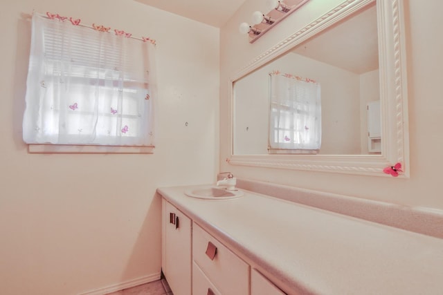 bathroom with tile patterned flooring and vanity