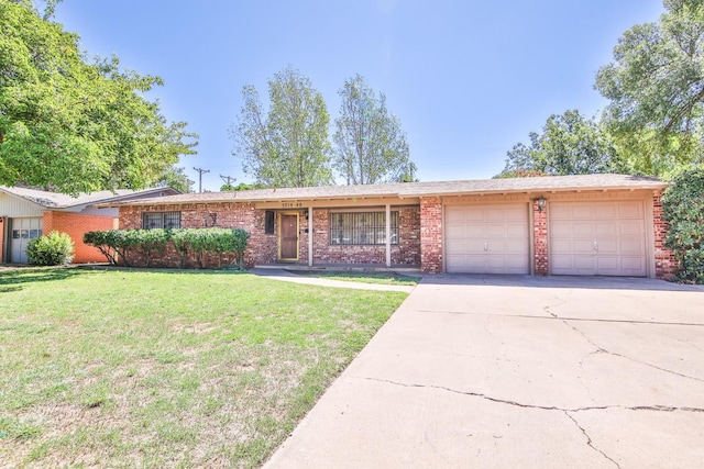 ranch-style house with a garage and a front yard