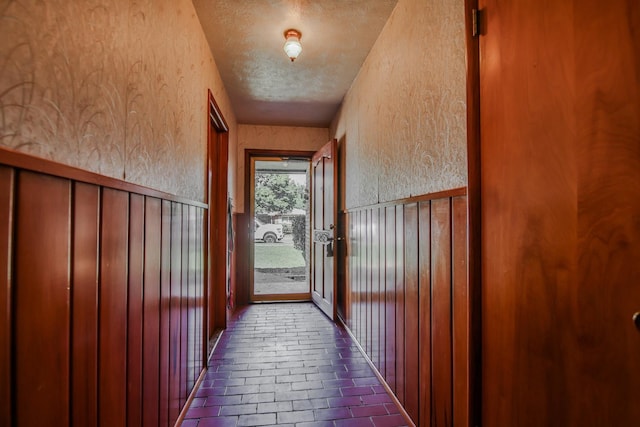 doorway with a textured ceiling