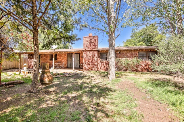 back of property with a patio area