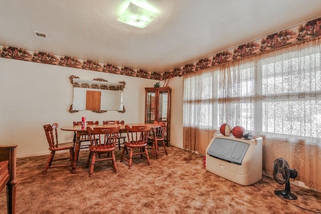 view of carpeted dining space