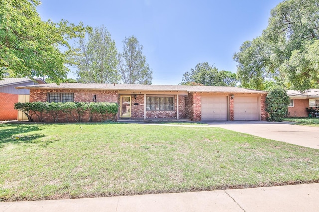 ranch-style home with a garage and a front yard