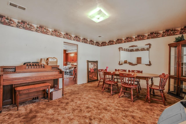 dining area featuring carpet floors