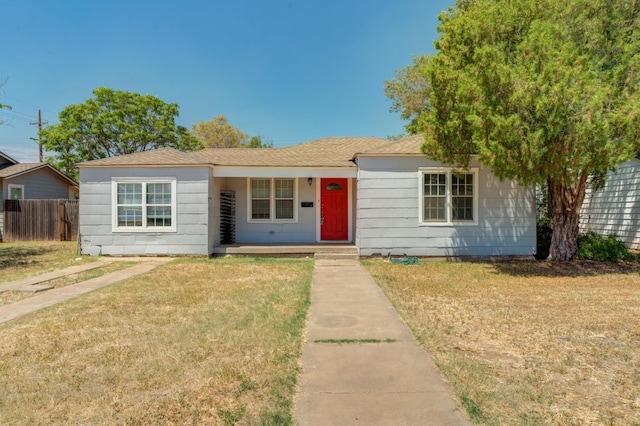 single story home featuring a front yard