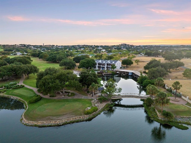 aerial view at dusk with a water view