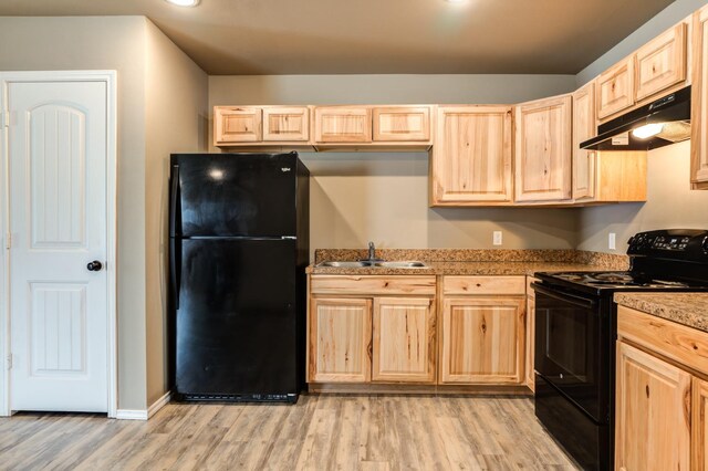 kitchen featuring sink, black appliances, and light brown cabinets