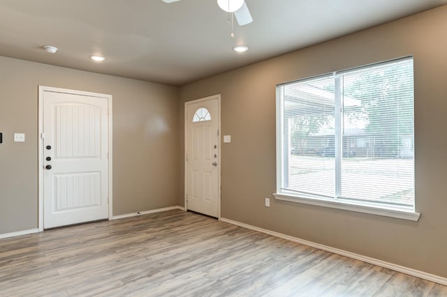 foyer entrance featuring ceiling fan and light hardwood / wood-style flooring