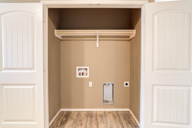 laundry area featuring hardwood / wood-style flooring, hookup for a washing machine, and electric dryer hookup