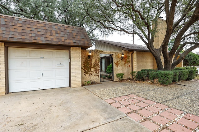 ranch-style home featuring a garage