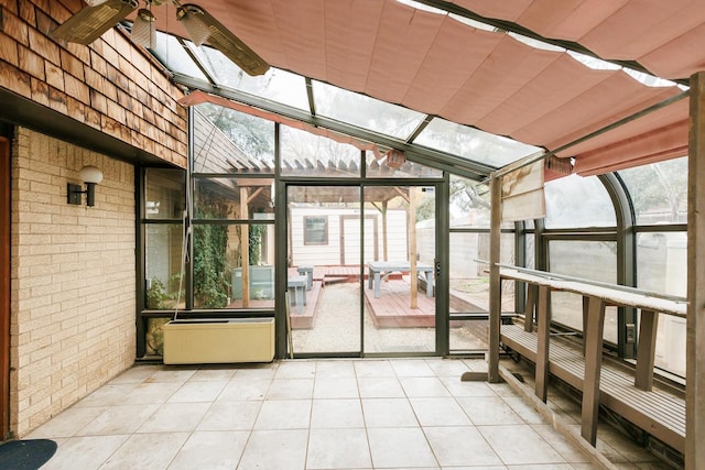 unfurnished sunroom featuring a healthy amount of sunlight