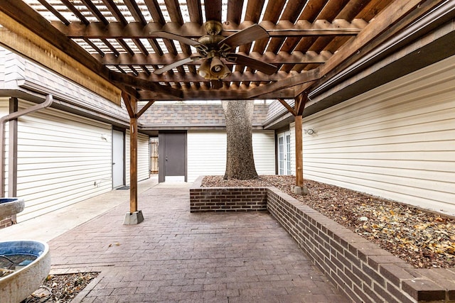 view of patio / terrace with ceiling fan and a pergola