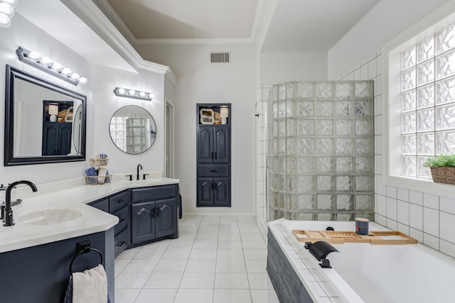 bathroom with tile patterned floors, a sink, a bath, double vanity, and visible vents