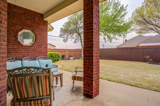 view of patio featuring an outdoor hangout area and a fenced backyard