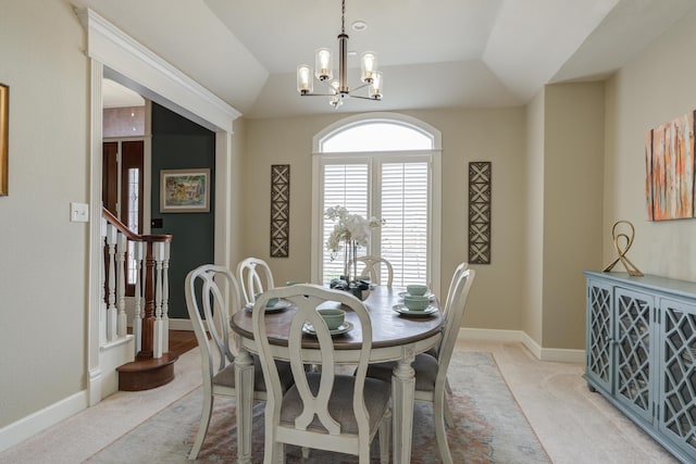 dining space featuring stairs, baseboards, a chandelier, and light colored carpet