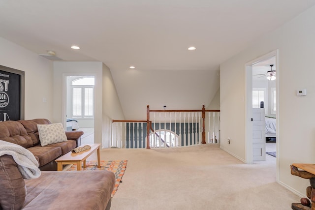living room featuring recessed lighting, plenty of natural light, a ceiling fan, and carpet