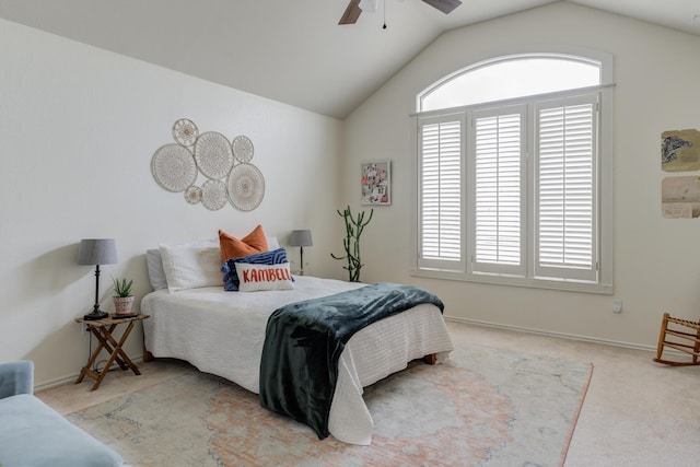 carpeted bedroom with vaulted ceiling, a ceiling fan, and baseboards