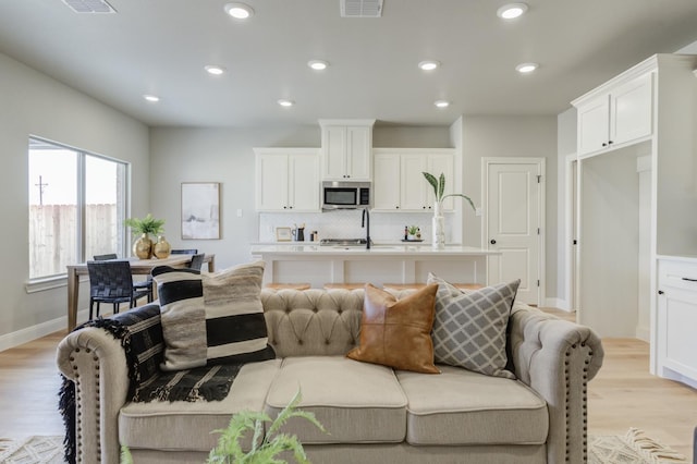 living room with light hardwood / wood-style floors