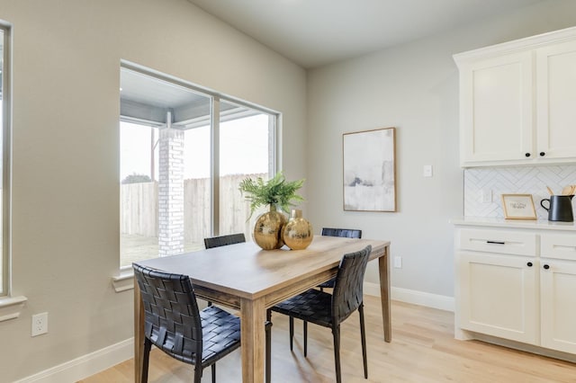 dining space with light wood-type flooring