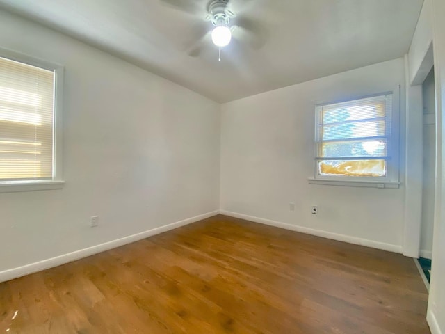 spare room featuring hardwood / wood-style flooring and ceiling fan